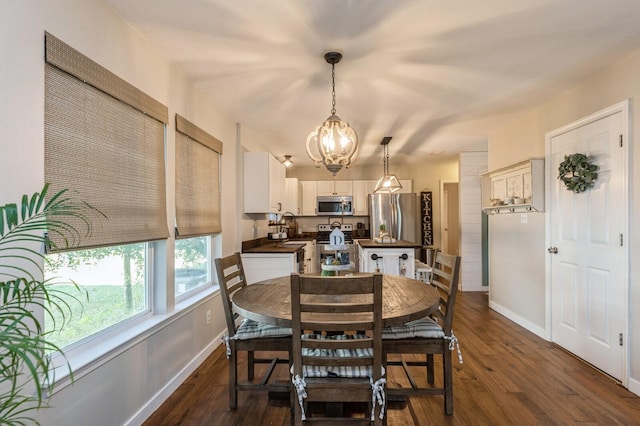 dining space featuring a chandelier and dark hardwood / wood-style floors