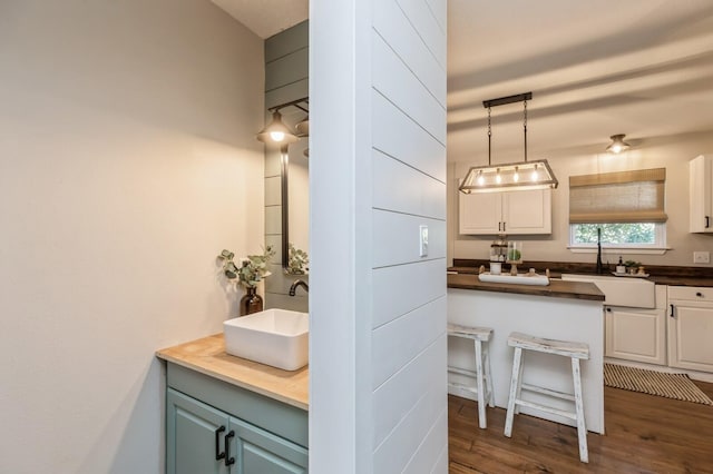 bathroom with vanity and hardwood / wood-style floors