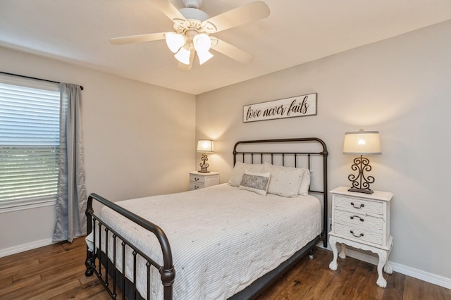 bedroom featuring dark hardwood / wood-style flooring and ceiling fan