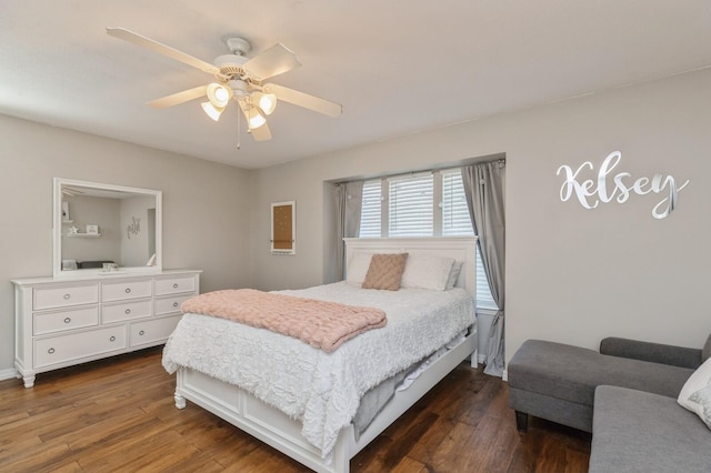 bedroom featuring ceiling fan and dark hardwood / wood-style floors