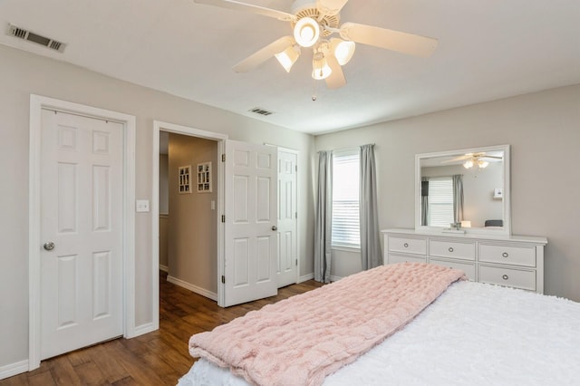 bedroom featuring ceiling fan and dark hardwood / wood-style flooring