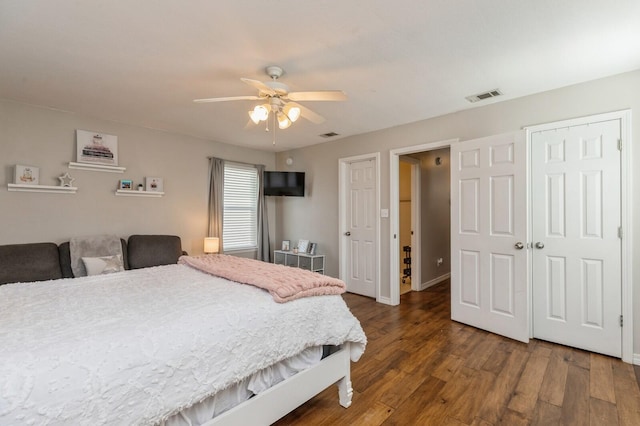 bedroom featuring dark hardwood / wood-style flooring and ceiling fan