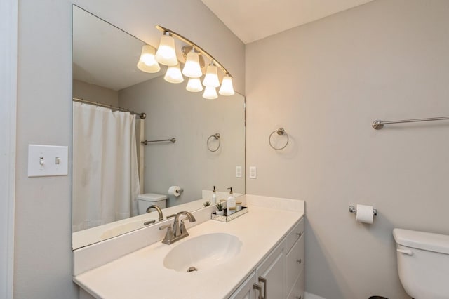 bathroom with toilet and vanity