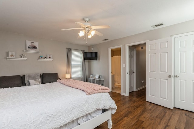 bedroom with ceiling fan, ensuite bath, a closet, and dark hardwood / wood-style flooring