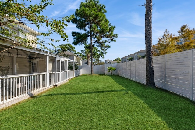 view of yard with ceiling fan