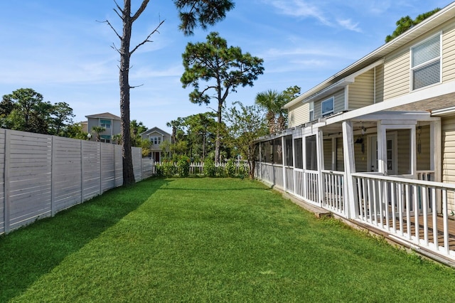 view of yard featuring a sunroom