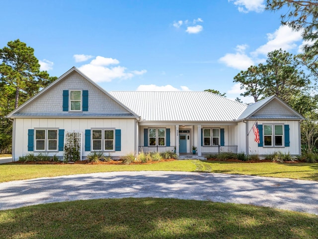 view of front of home featuring a front lawn and a porch