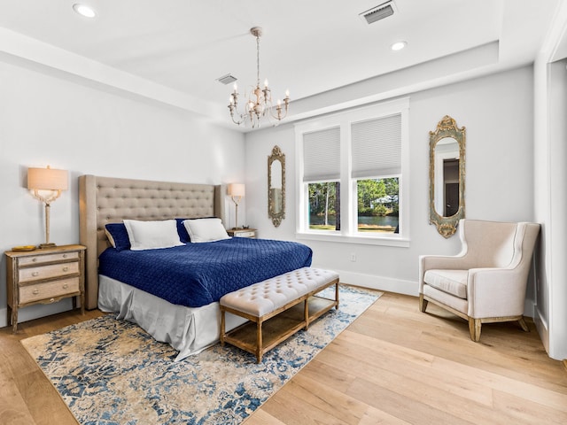 968 Don Bishop Rd, Santa Rosa Beach, FL 32459 - bedroom with a chandelier, recessed lighting, light wood-style flooring, baseboards, and a raised ceiling