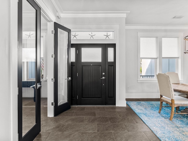 968 Don Bishop Rd, Santa Rosa Beach, FL 32459 - foyer with crown molding, baseboards, and dark stone finish flooring
