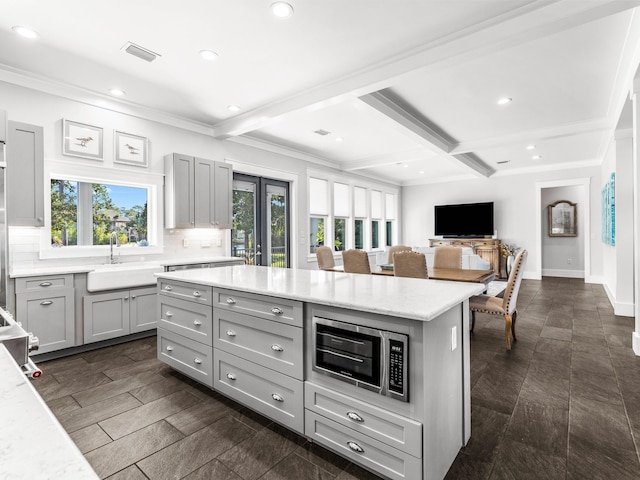968 Don Bishop Rd, Santa Rosa Beach, FL 32459 - kitchen featuring a sink, gray cabinets, stainless steel microwave, backsplash, and recessed lighting