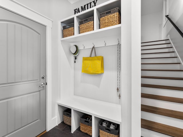 mudroom featuring dark tile patterned floors