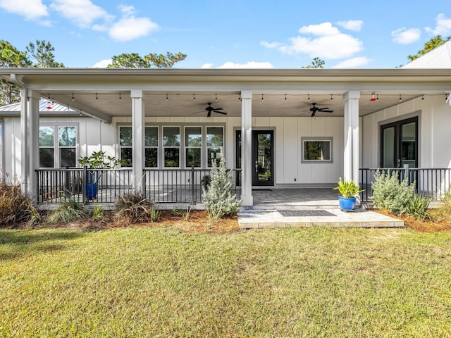 968 Don Bishop Rd, Santa Rosa Beach, FL 32459 - back of house featuring ceiling fan, board and batten siding, a lawn, and a patio