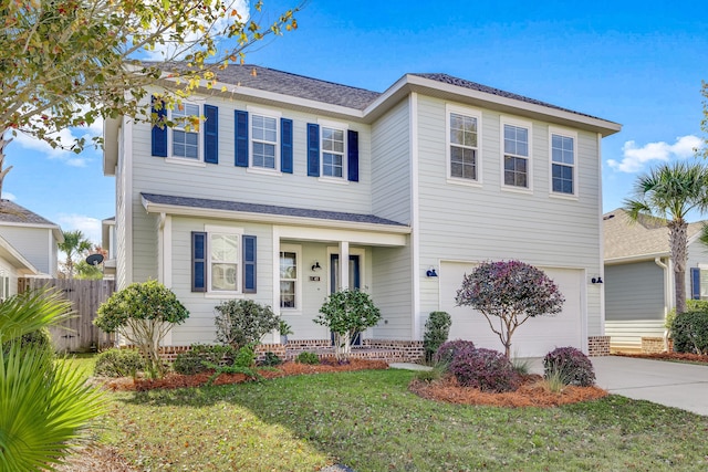 view of front of house featuring a front lawn and a garage