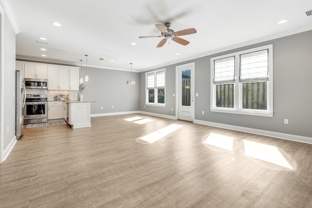 unfurnished living room with ceiling fan, light hardwood / wood-style flooring, and crown molding