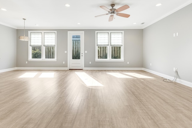 unfurnished living room featuring ceiling fan, light wood-type flooring, and ornamental molding