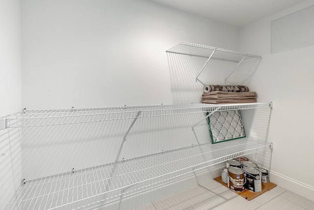 walk in closet featuring tile patterned flooring