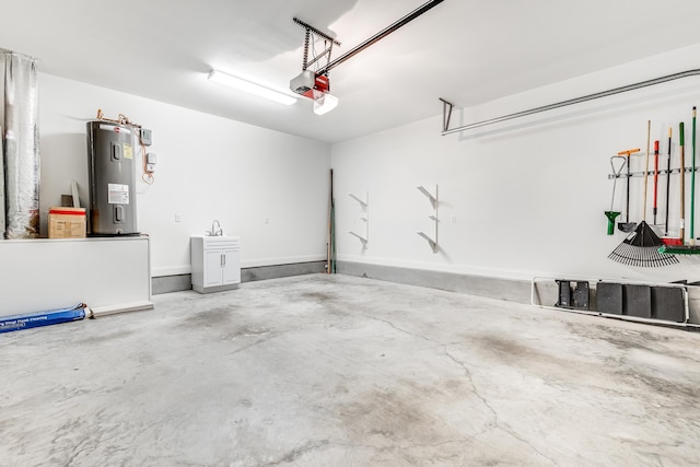 garage featuring electric water heater and a garage door opener