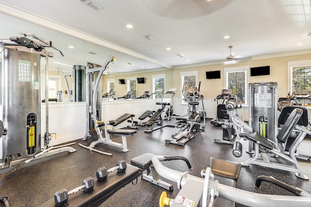 workout area with ceiling fan and crown molding