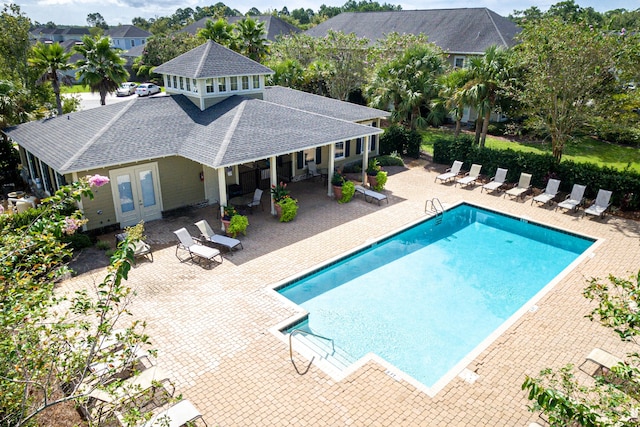 view of pool featuring french doors and a patio