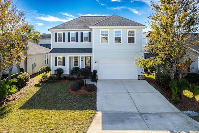 view of front property with a front yard and a garage