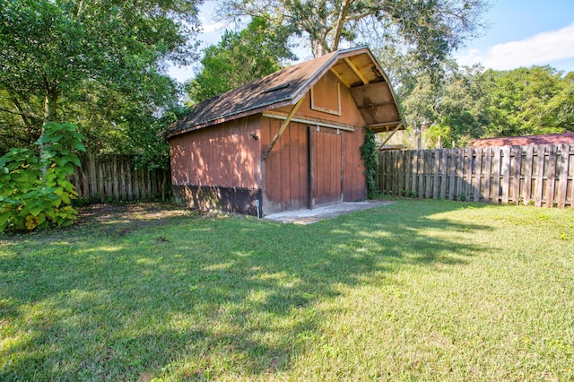 view of outbuilding with a lawn