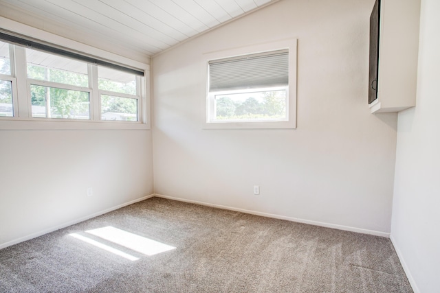 unfurnished room with carpet, lofted ceiling, and wooden ceiling