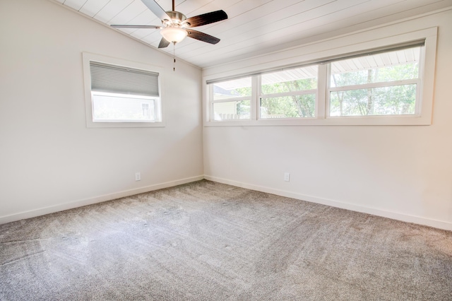 empty room with plenty of natural light, carpet, wood ceiling, and vaulted ceiling