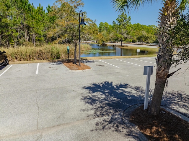 uncovered parking lot with a water view