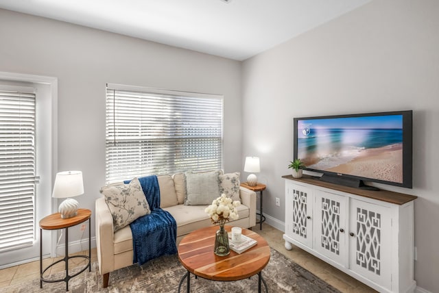 living area featuring baseboards