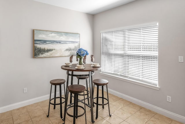 tiled dining space with baseboards