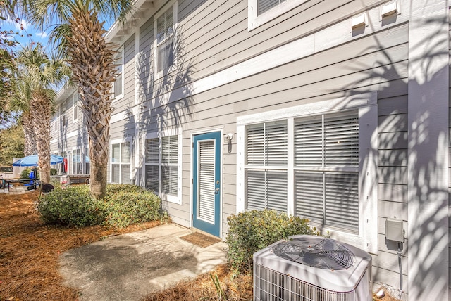 doorway to property with central AC unit