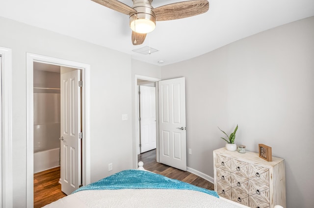 bedroom featuring baseboards, wood finished floors, and a ceiling fan