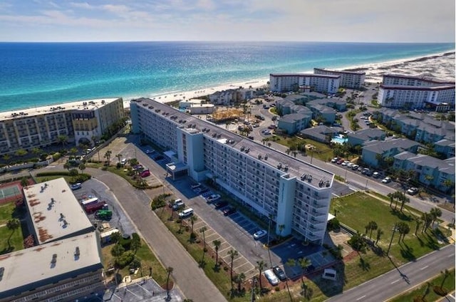 drone / aerial view featuring a view of the beach and a water view