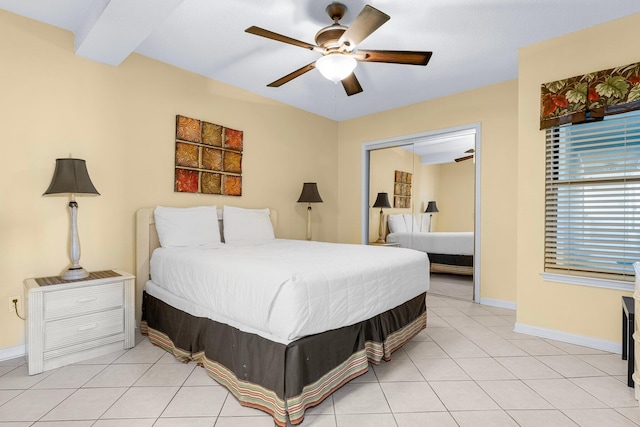 bedroom featuring a closet, ceiling fan, and light tile patterned flooring