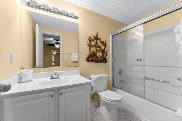 full bathroom with combined bath / shower with glass door, tile patterned floors, a textured ceiling, ceiling fan, and toilet