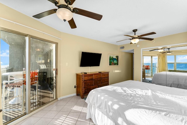 tiled bedroom with access to outside and ceiling fan