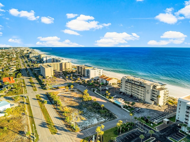 bird's eye view featuring a water view and a view of the beach