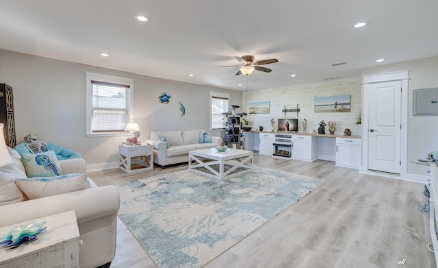 248 Sukoshi Dr, Panama City, FL 32404 - living area with a ceiling fan, recessed lighting, light wood finished floors, electric panel, and baseboards