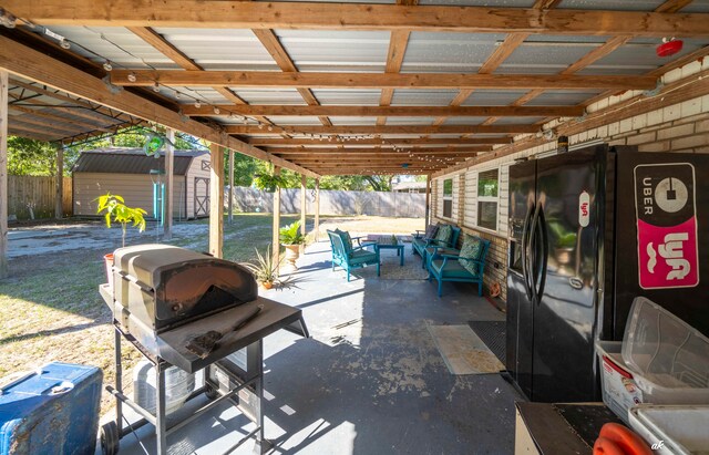 view of patio / terrace with a shed