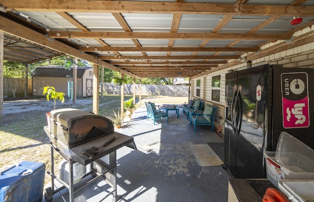 248 Sukoshi Dr, Panama City, FL 32404 - view of patio with a storage shed, a fenced backyard, an outdoor structure, and outdoor lounge area