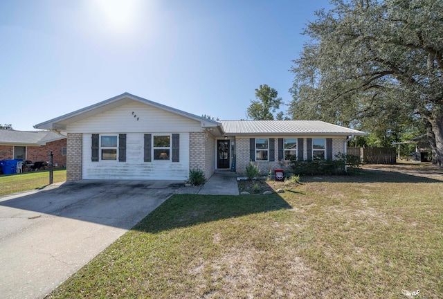 ranch-style home with a front yard