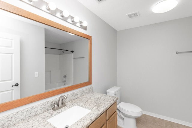 full bathroom featuring washtub / shower combination, tile patterned floors, toilet, and vanity