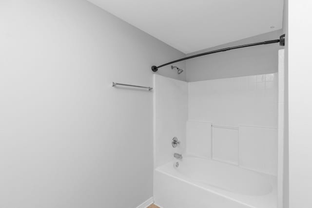 bathroom with bathing tub / shower combination