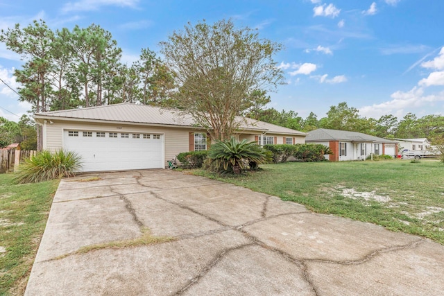 ranch-style home with a garage and a front lawn