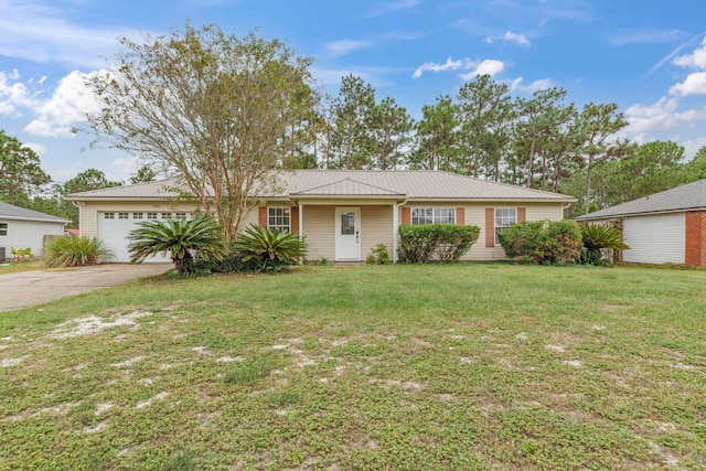 single story home featuring a garage and a front yard