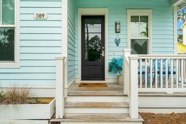 view of exterior entry featuring a porch