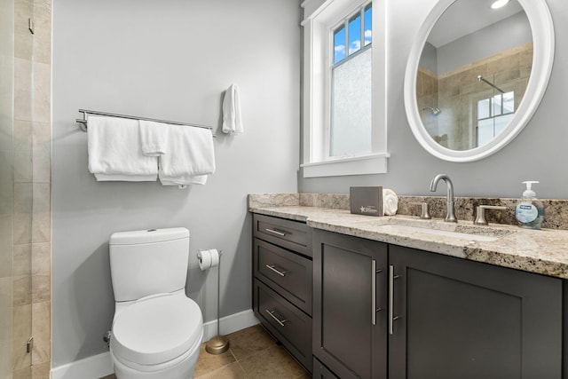 bathroom featuring toilet, vanity, an enclosed shower, and tile patterned floors