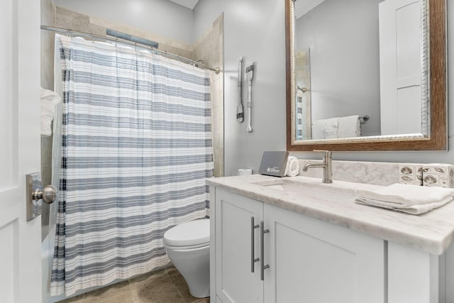 bathroom with toilet, vanity, a shower with shower curtain, and tile patterned flooring