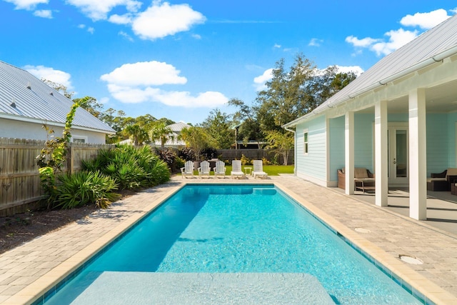 view of swimming pool with a patio area