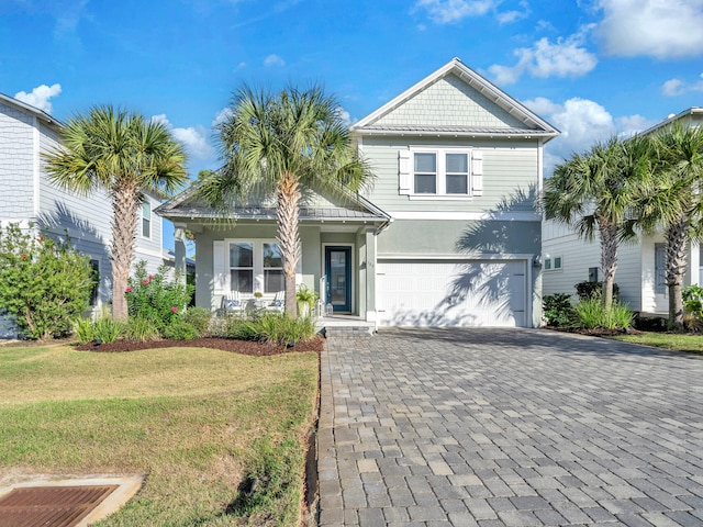 view of front facade with a garage and a front yard